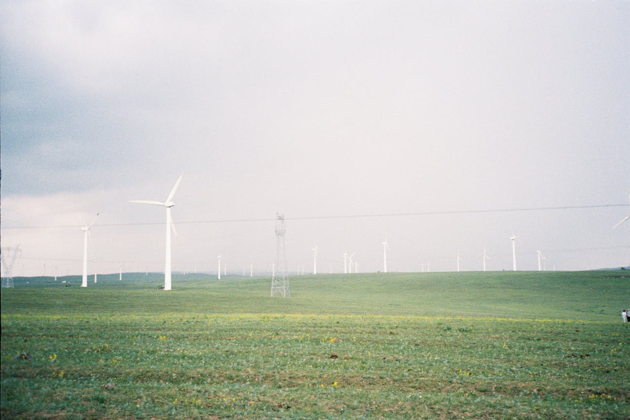 Expansive landscape with wind turbines in Inner Mongolia, China, promoting renewable energy.